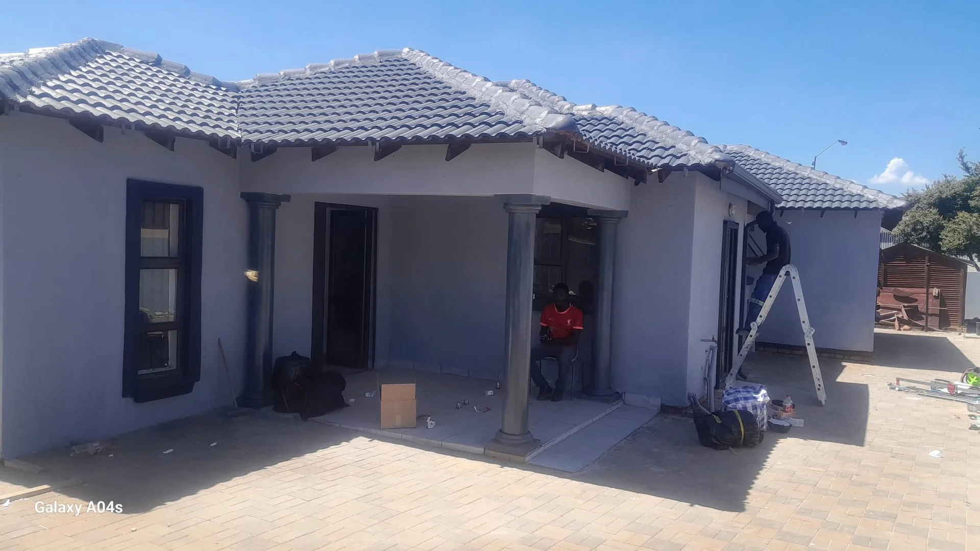 Professional painter applying a fresh coat of paint to an interior wall