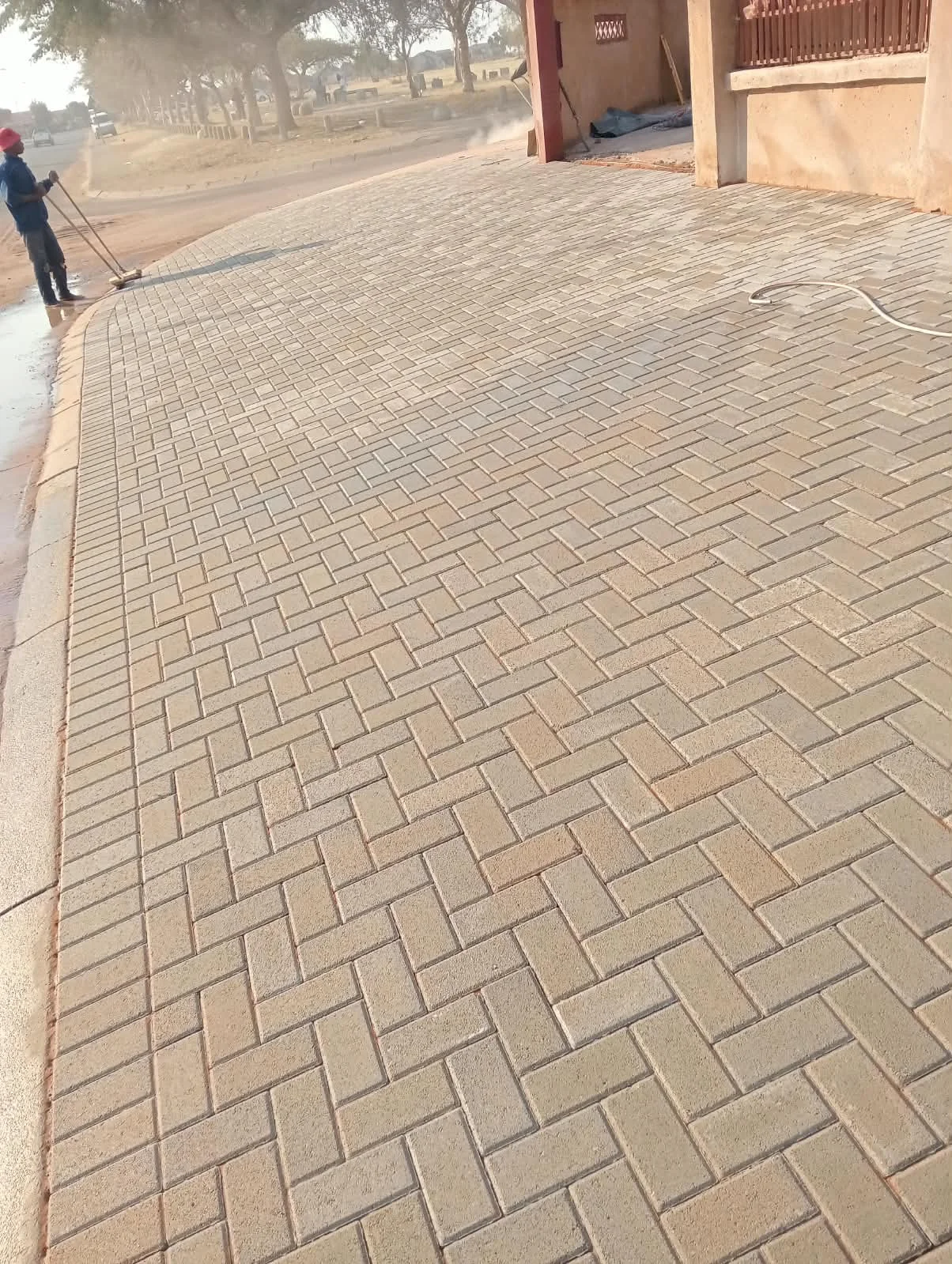 Newly installed brick paving on a residential driveway